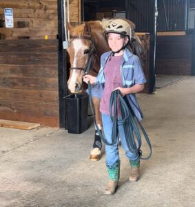 Leading Horse Outside for Riding Lessons